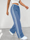 Pantalones streetwear para mujer con perneras anchas | Detalles deportivos con cinturón