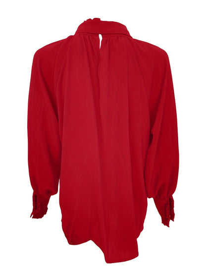 Blusa elegante de mujer con lazo en el cuello