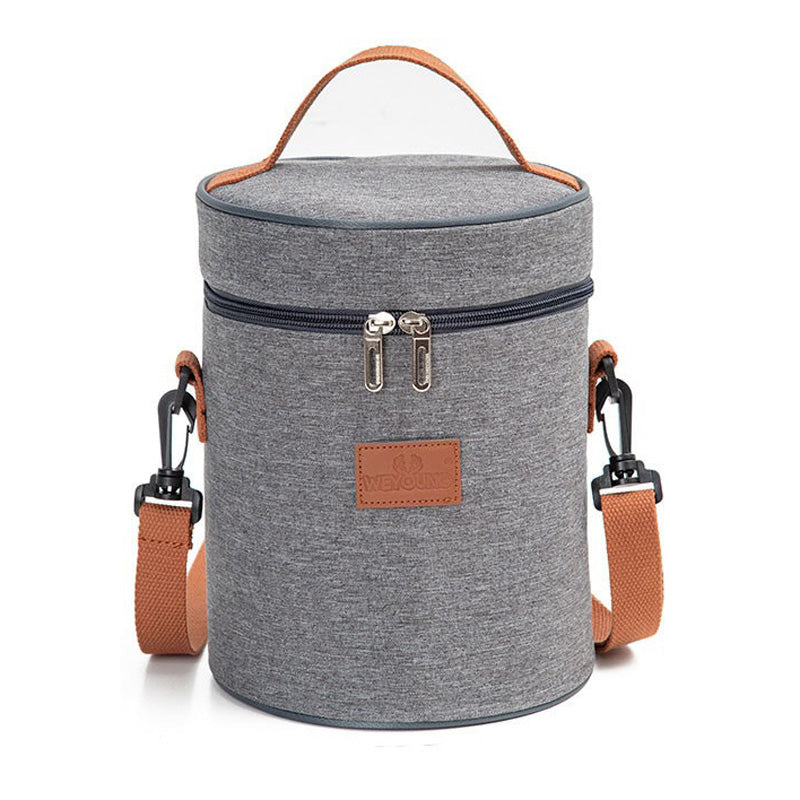 Gray canvas lunch bag with brown handles