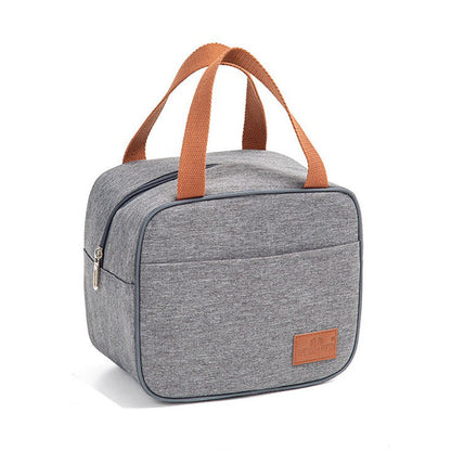 Gray canvas lunch bag with brown handles